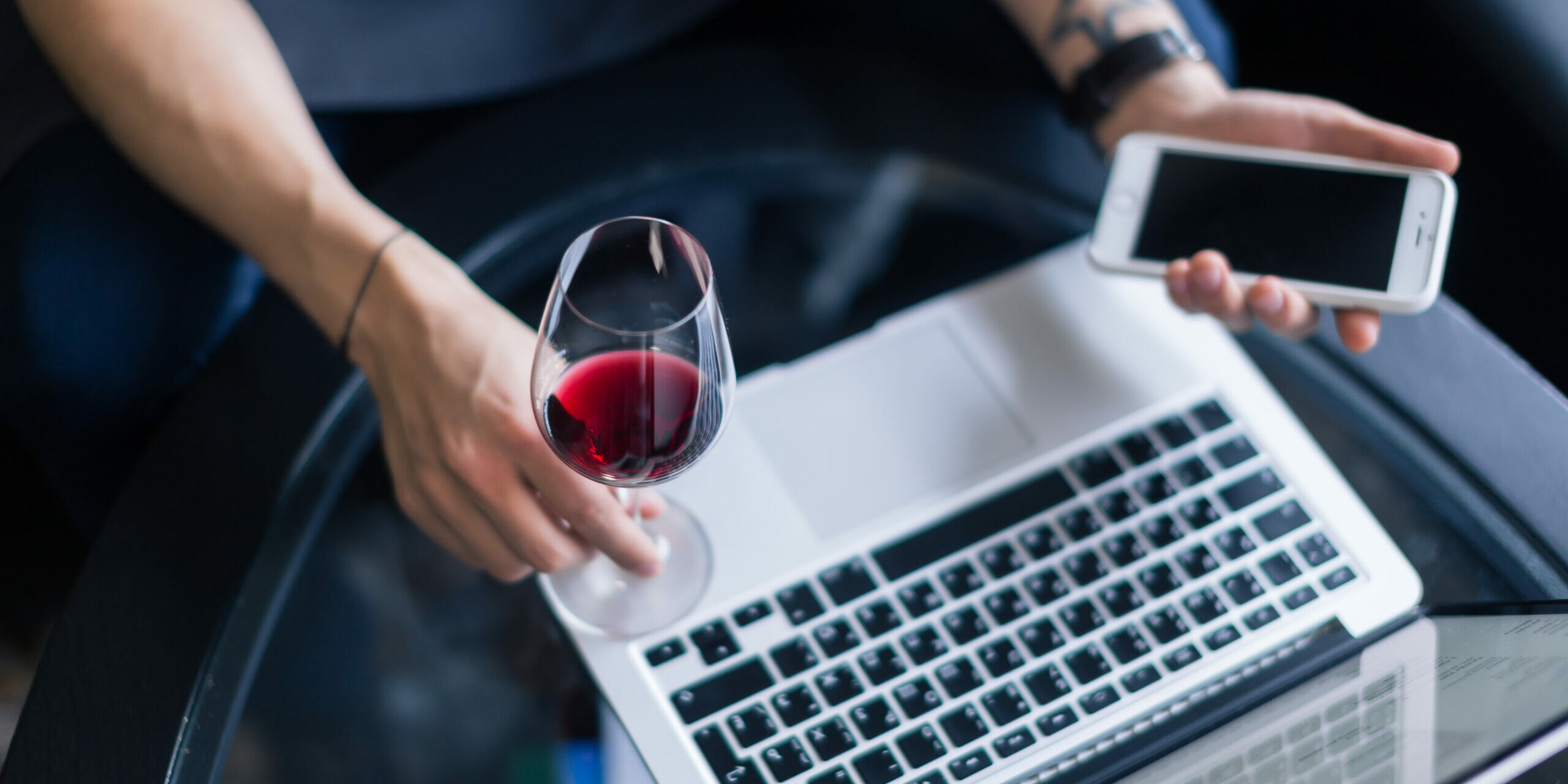 Portrait,Of,Senior,Sommelier,Sitting,In,Front,Of,Laptop,At